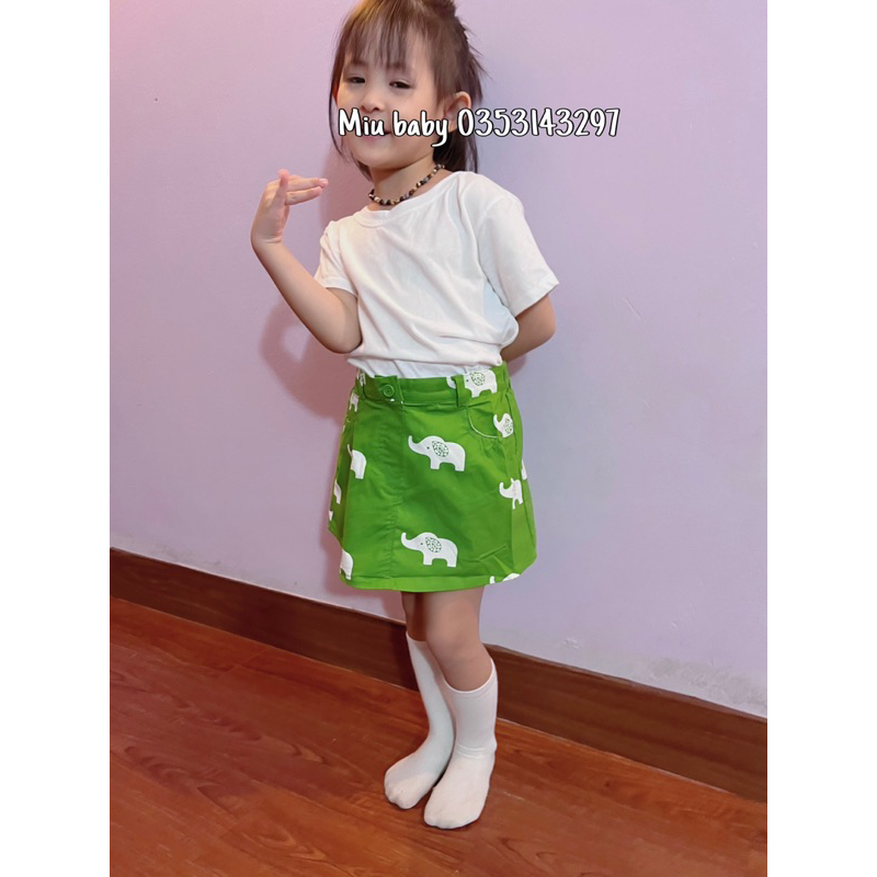 Chân váy bé gái màu xanh hoạ tiết du xin