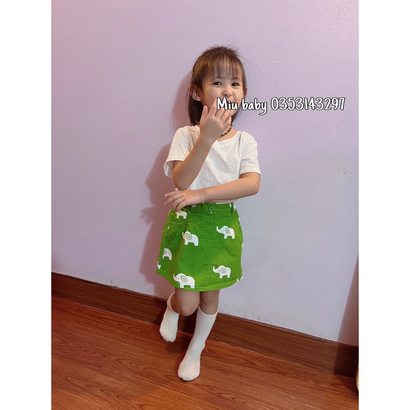 Chân váy bé gái màu xanh hoạ tiết du xin