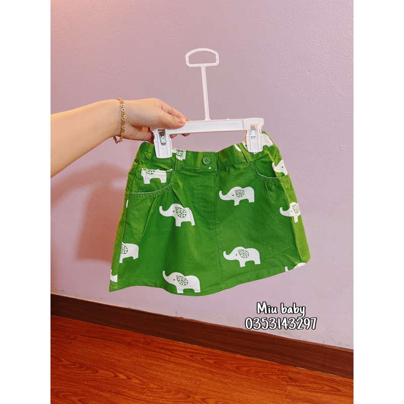 Chân váy bé gái màu xanh hoạ tiết du xin