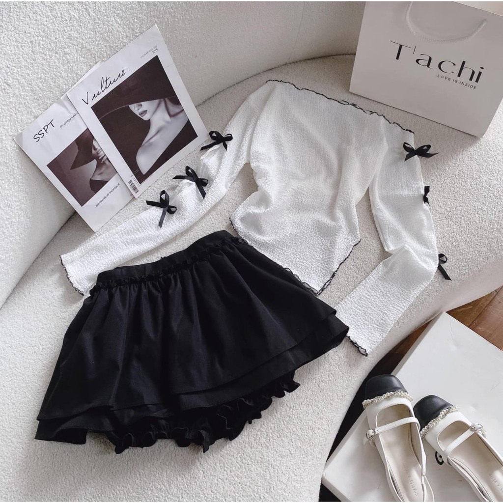 Set áo xốp lệch vai tay đính nơ xéo tà chân váy tầng