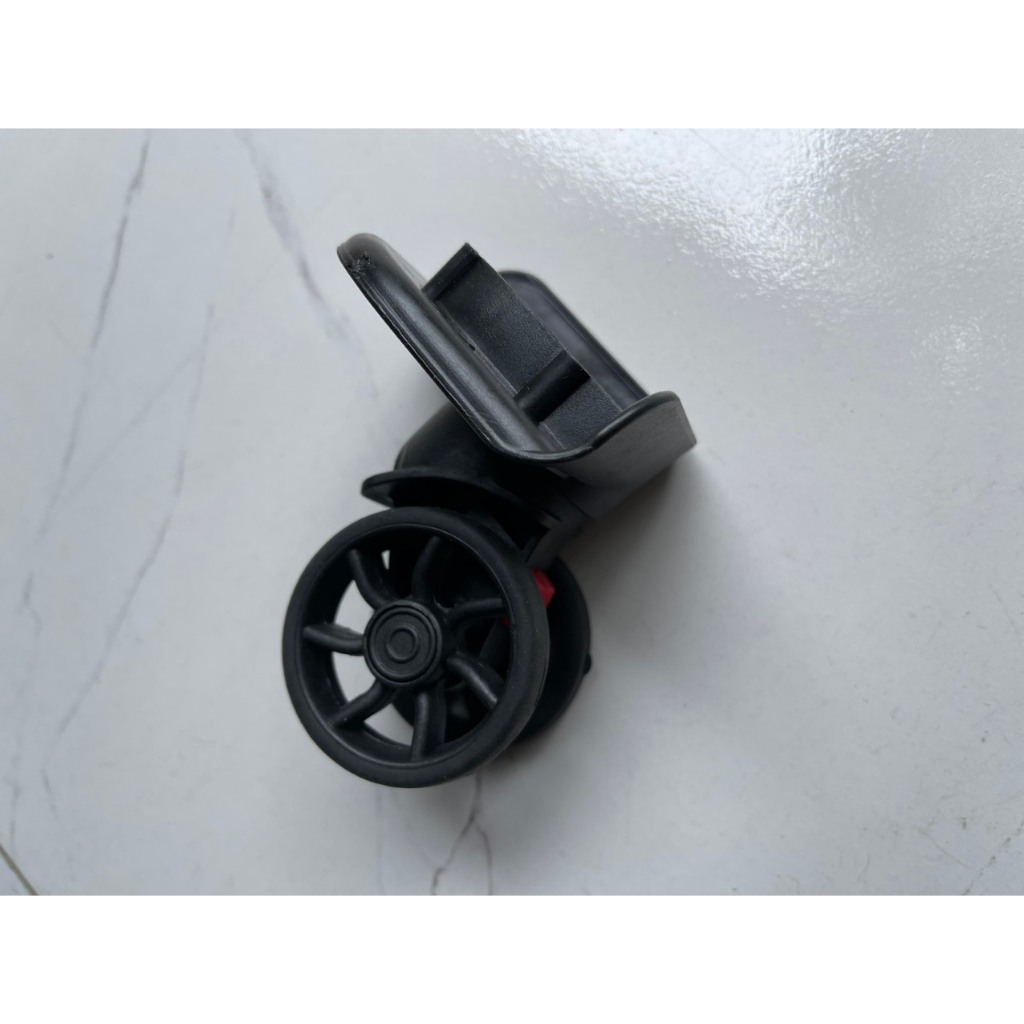 Bánh xe thay thế có chốt tháo màu đỏ dành cho Vali khung nhôm khóa sập