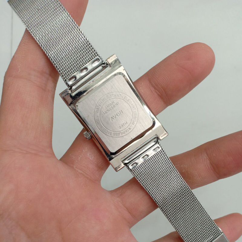Đồng hồ nam nữ si nhật mặt tank vuông hiệu AVON JF dây thép lụa màu bạc độ mới 89%