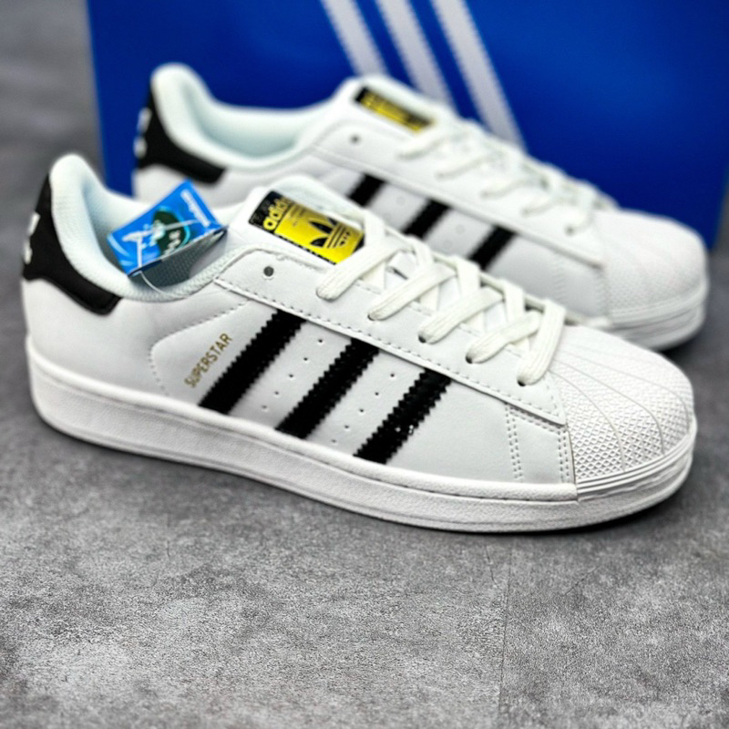 Giày_Adidas Superstar Màu Trắng 3 Sọc Đen Tem Vàng,Giày thể thao nam nữ Adidas mũi sò trắng sọc đen bản S.Cấp