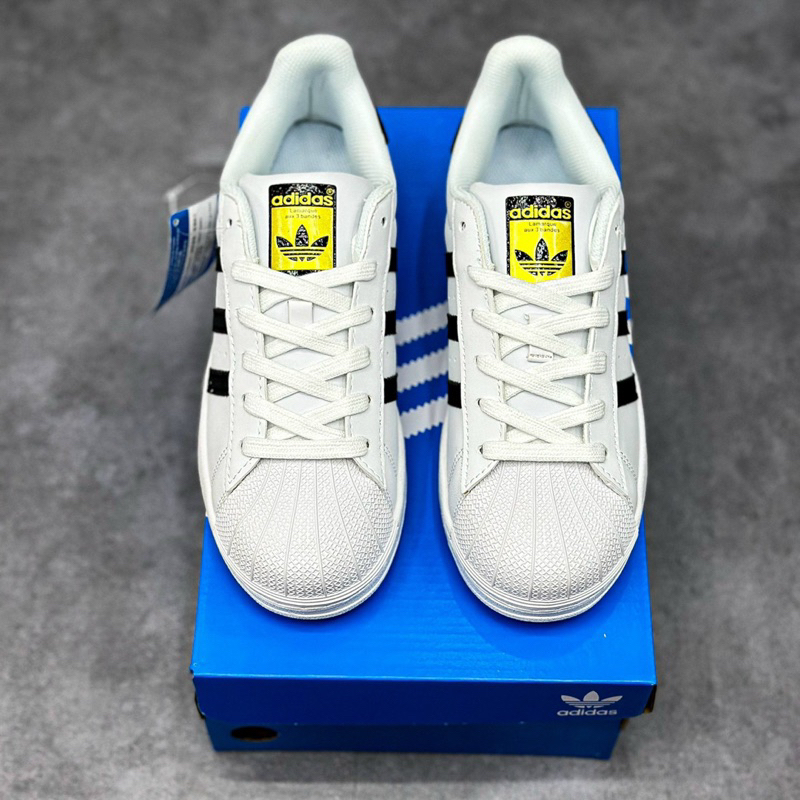 Giày_Adidas Superstar Màu Trắng 3 Sọc Đen Tem Vàng,Giày thể thao nam nữ Adidas mũi sò trắng sọc đen bản S.Cấp