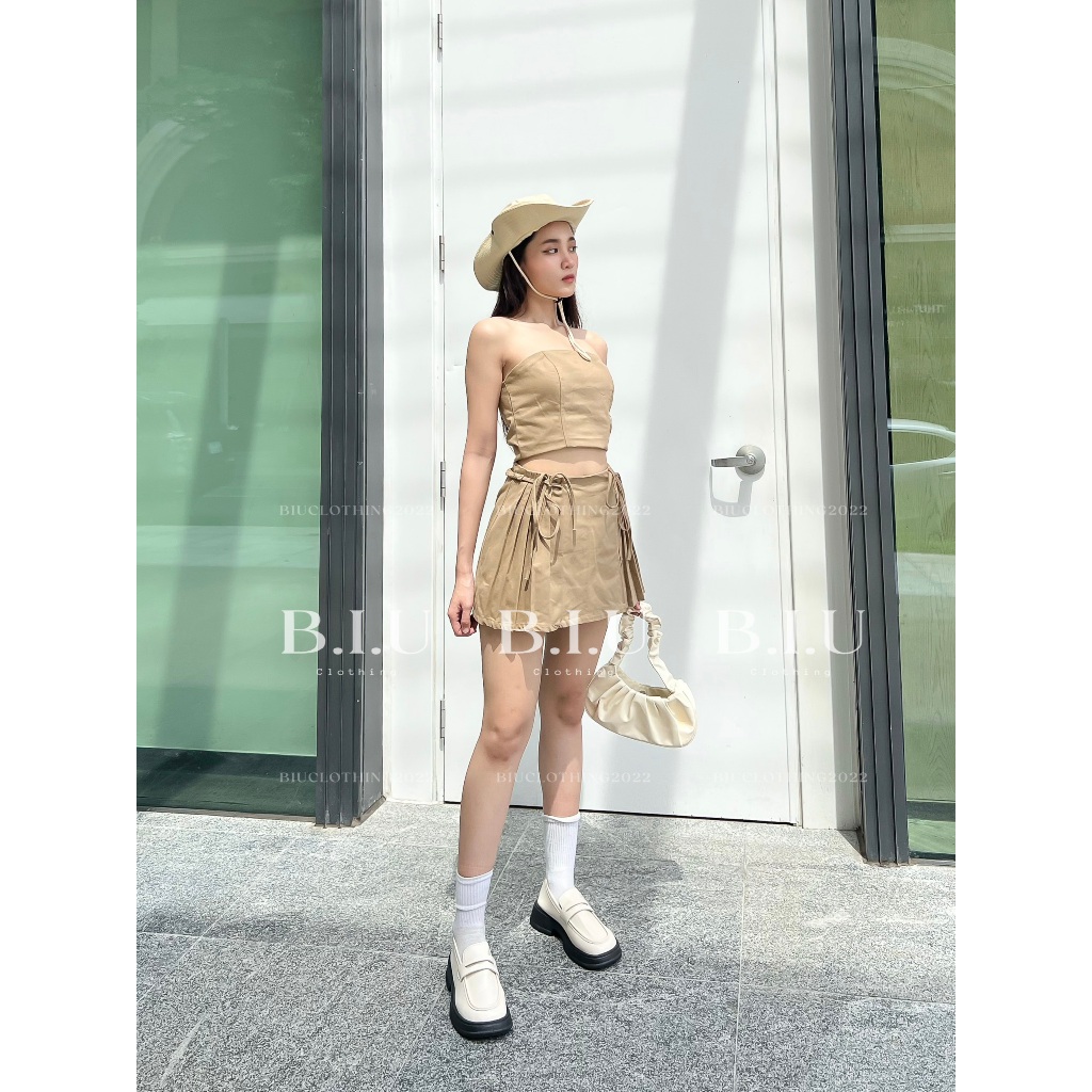 Set áo quây crotop chân váy phối xếp ly dây belt nhún thắt nơ Nora Set Biu Clothing BB0144 màu nâu rêu