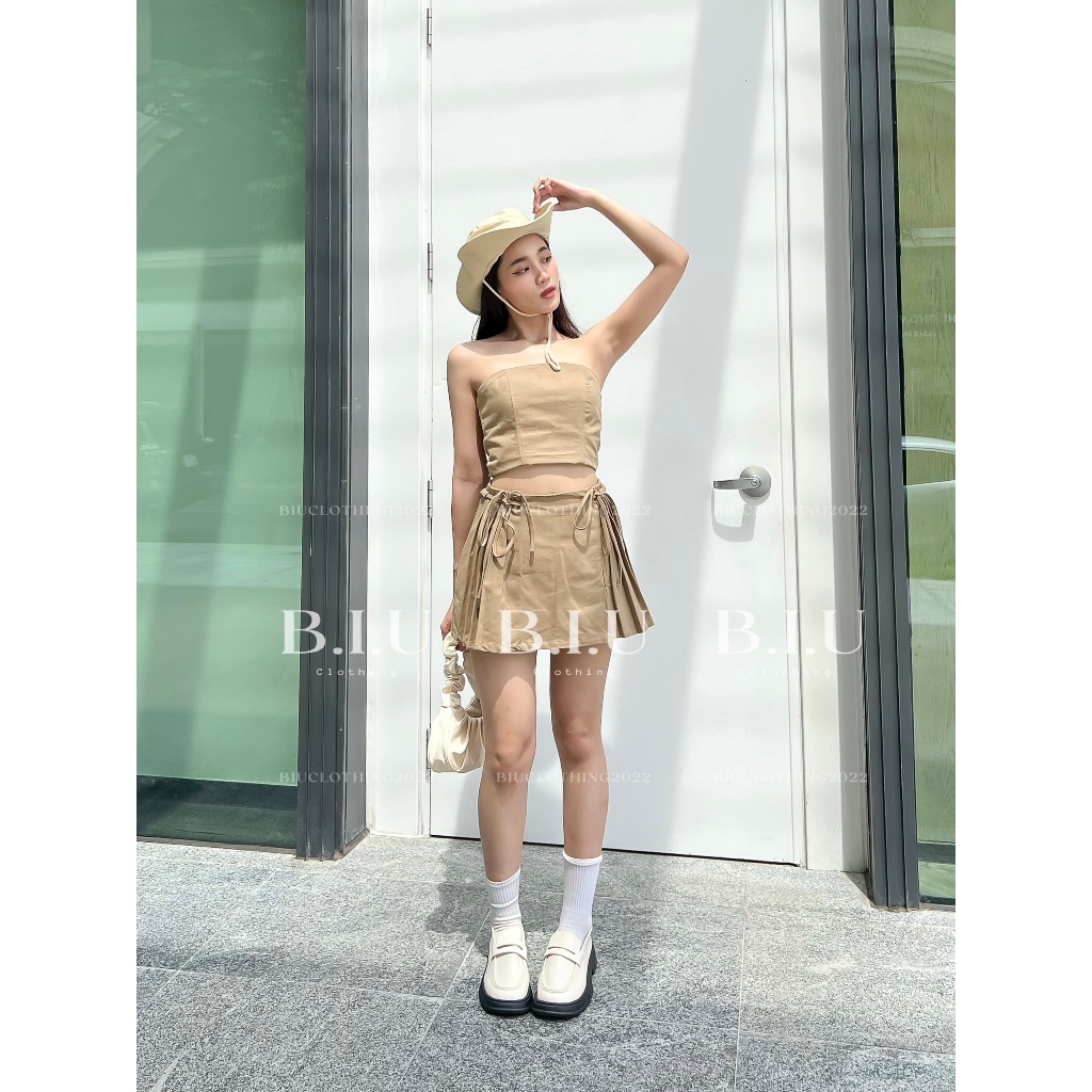 Set áo quây crotop chân váy phối xếp ly dây belt nhún thắt nơ Nora Set Biu Clothing BB0144 màu nâu rêu