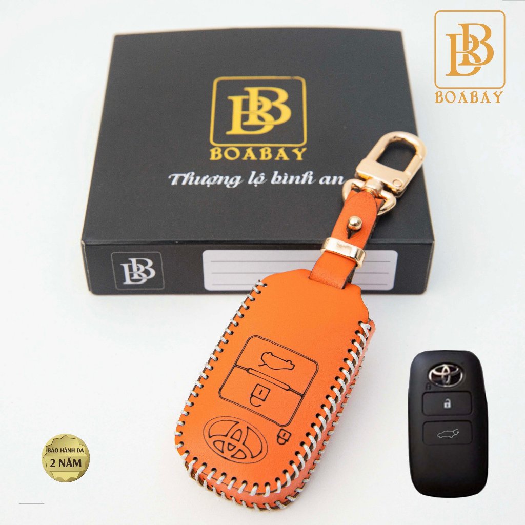 Bao da chìa khóa xe ôtô BB toyota yaris cross hev 2023 bọc chìa khóa smartkey da thật chính hãng OTOBOX khắc tên sđt