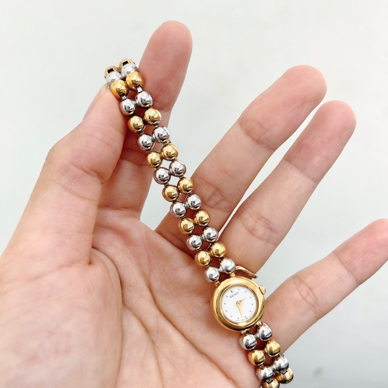 Đồng hồ si nữ hiệu Seiko dáng lắc bi vàng - Secondhand watch Seiko