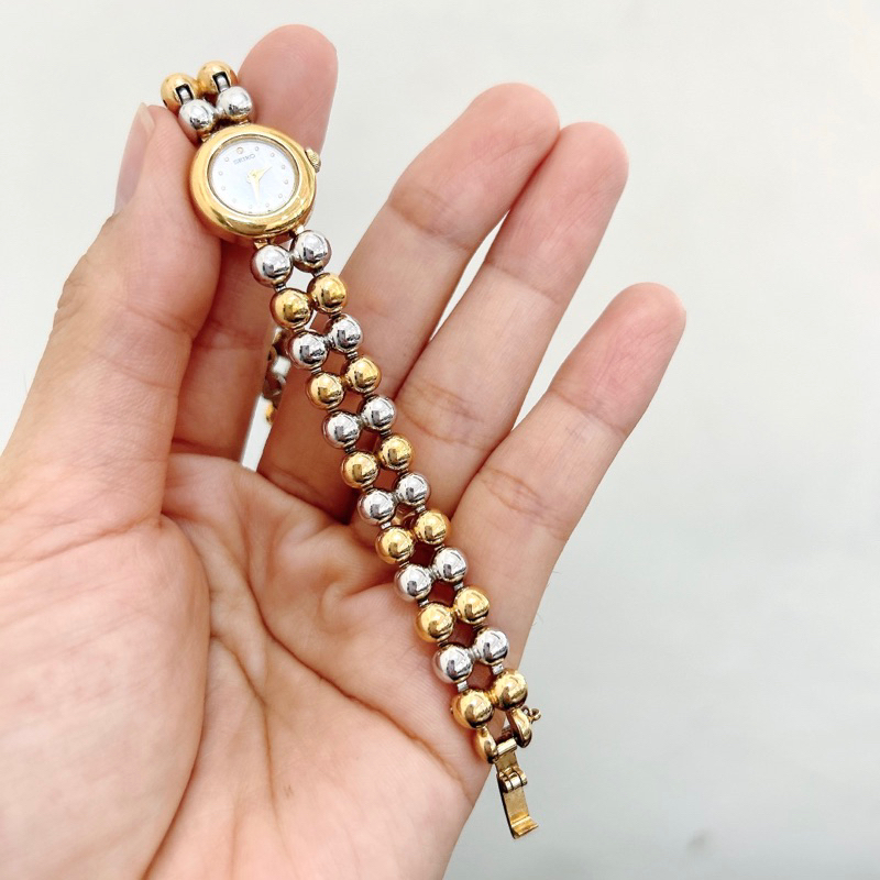 Đồng hồ si nữ hiệu Seiko dáng lắc bi vàng - Secondhand watch Seiko