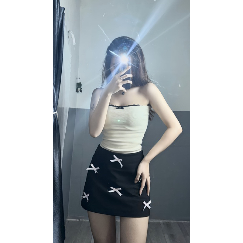 Chân váy đính nơ hồng