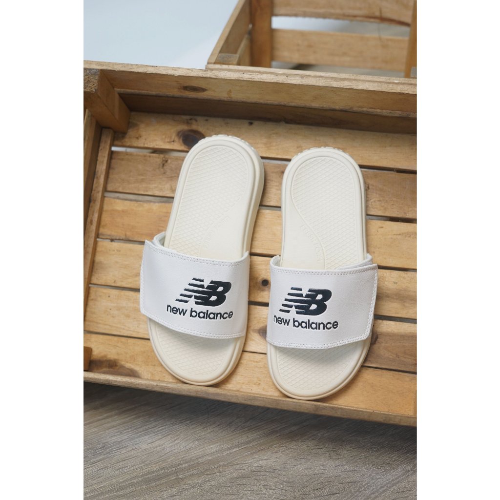 DÉP QUAI DÁN NGANG NAM NỮ NB LOGO CHỮ