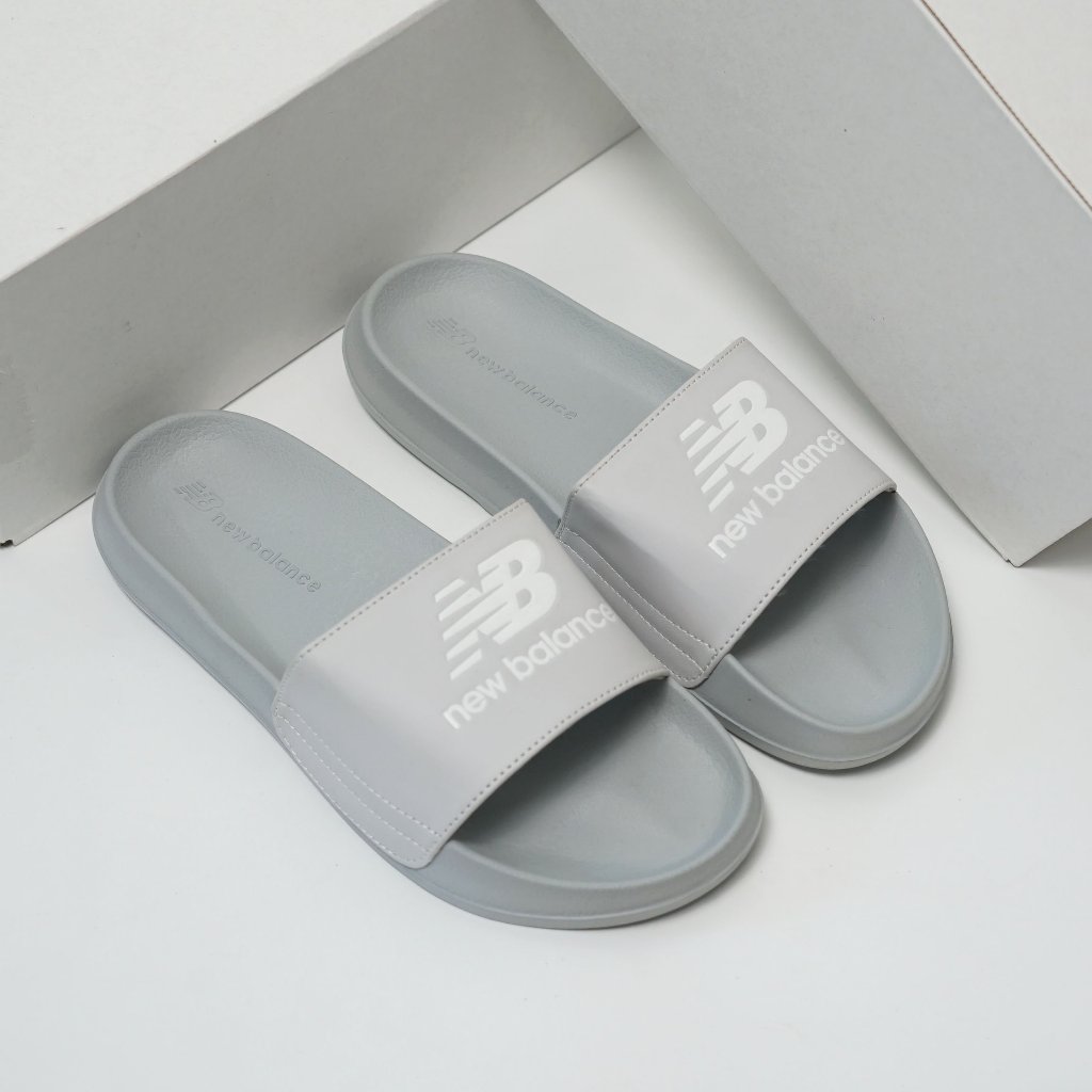 DÉP QUAI NGANG NỮ NB LOGO CHỮ