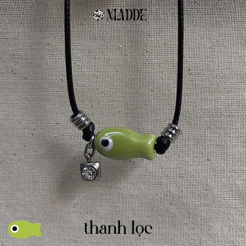 Vòng tay con cá mắt quỷ sứ may mắn với charm thép không teng gỉ Madde