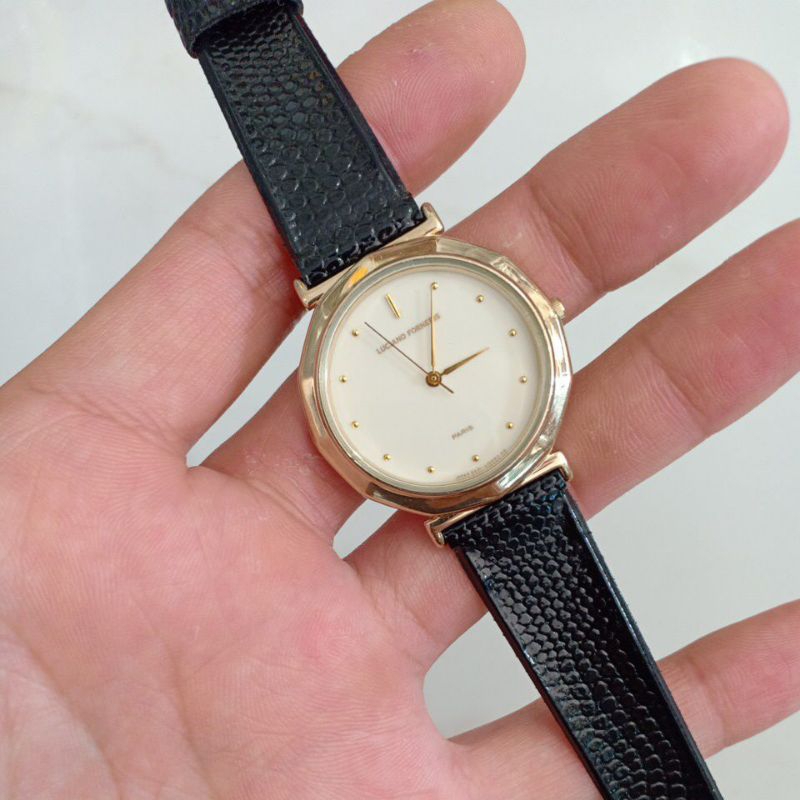 Đồng hồ nam nữ si nhật dây da ép hiệu FORNERIS PARIS mạ vàng độ mới cao 90%