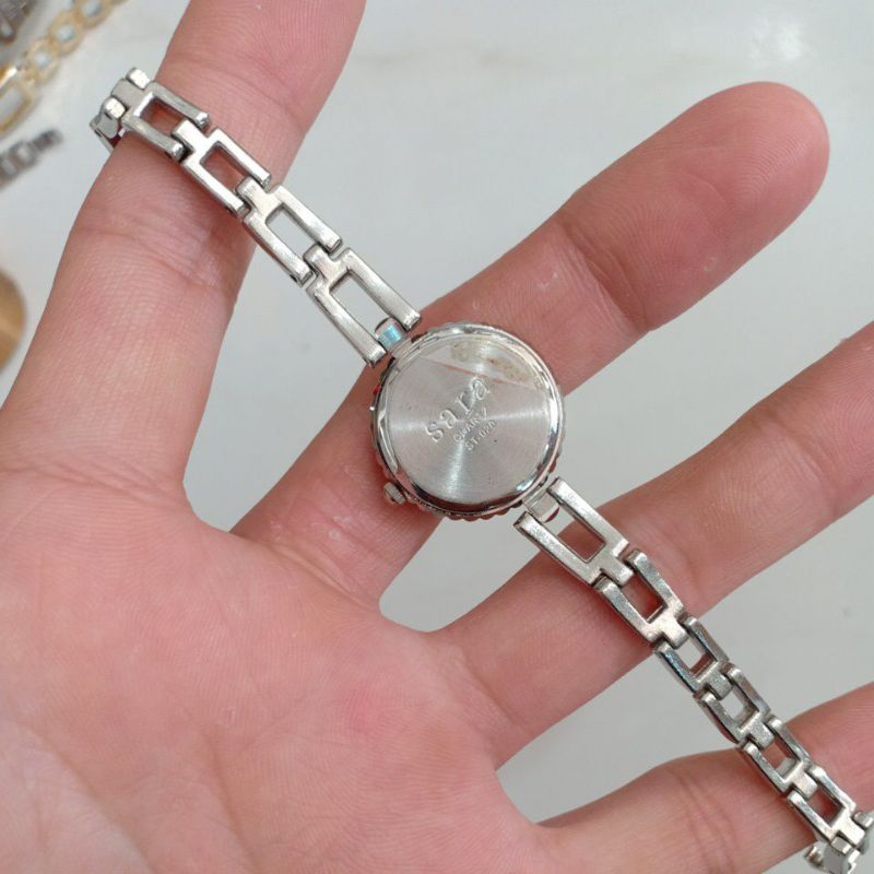 Đồng hồ si nữ hiệu SARA màu bạc mặt hình bông hoa độ mới cao 97%