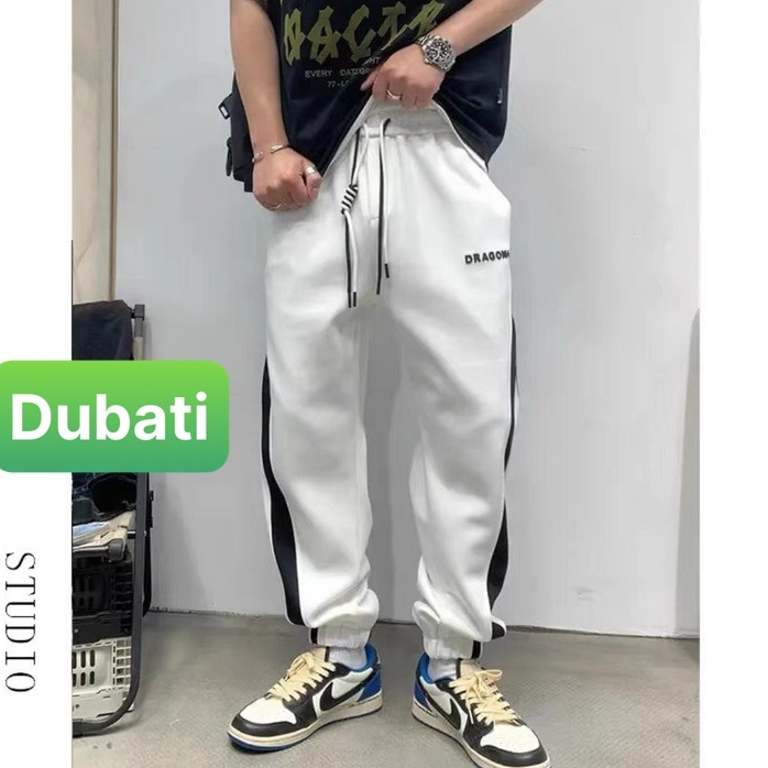 QUẦN JOGGER TRẮNG ĐEN SỌC CHÉO CHẤT NỈ DA CÁ NAM NỮ CÓ BO HOT TREND PHONG CÁCH CAO CẤP MỚI -DUBATI FASHION