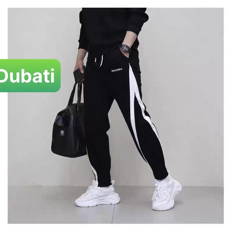 QUẦN JOGGER TRẮNG ĐEN SỌC CHÉO CHẤT NỈ DA CÁ NAM NỮ CÓ BO HOT TREND PHONG CÁCH CAO CẤP MỚI -DUBATI FASHION