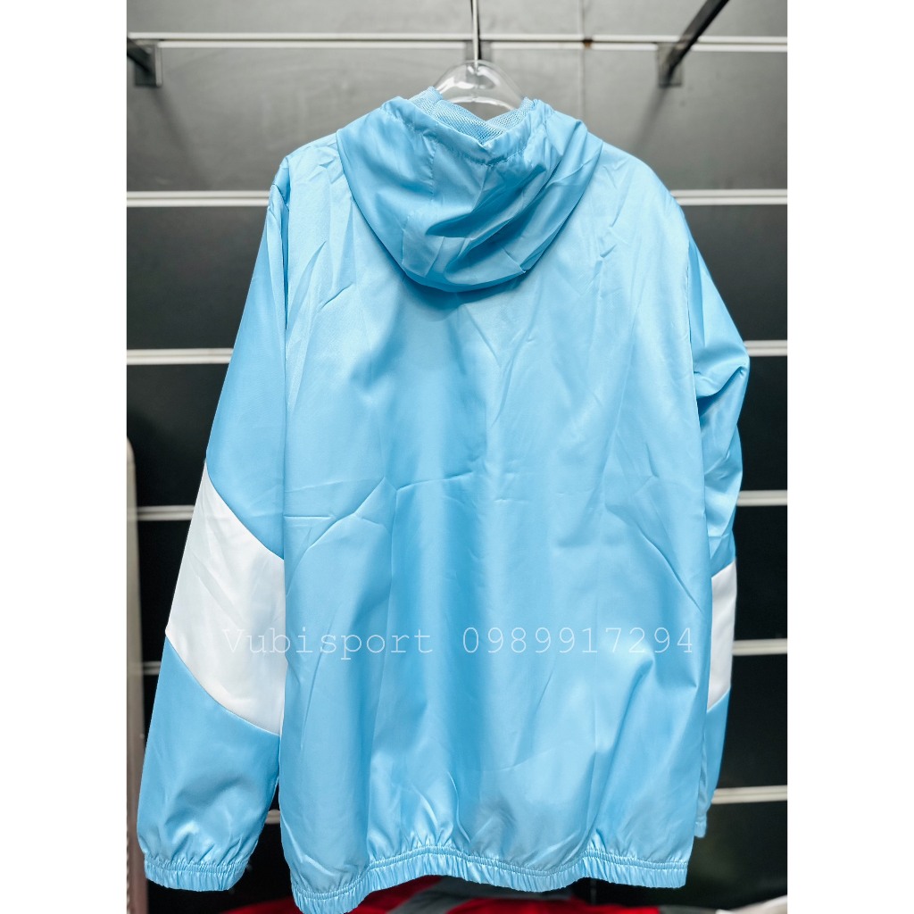 Áo gió thể thao các clb Manchester city màu xanh thể thao 2 lớp có túi mũ liền chống nước