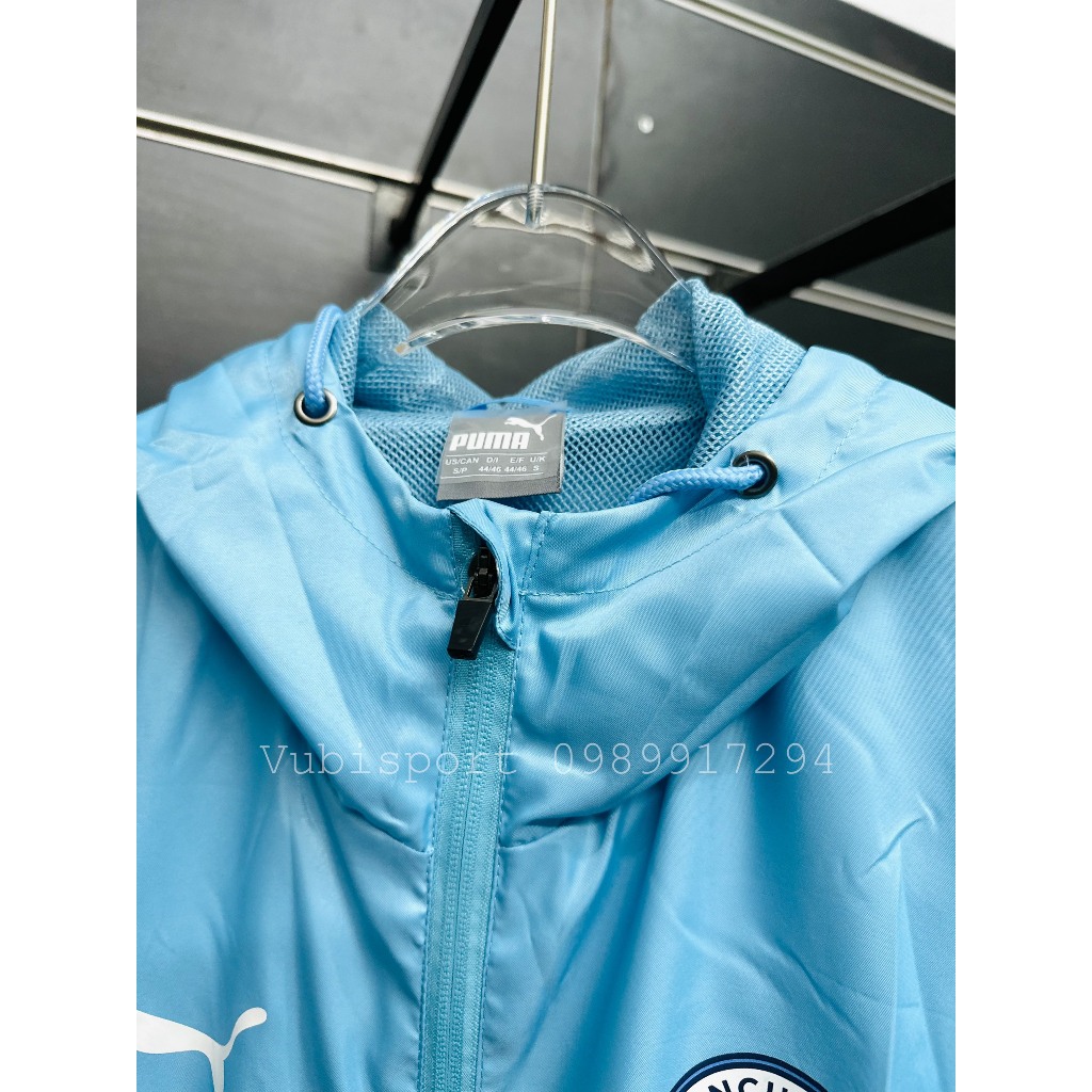 Áo gió thể thao các clb Manchester city màu xanh thể thao 2 lớp có túi mũ liền chống nước