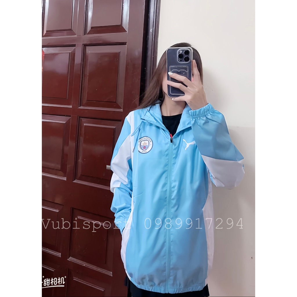 Áo gió thể thao các clb Manchester city màu xanh thể thao 2 lớp có túi mũ liền chống nước