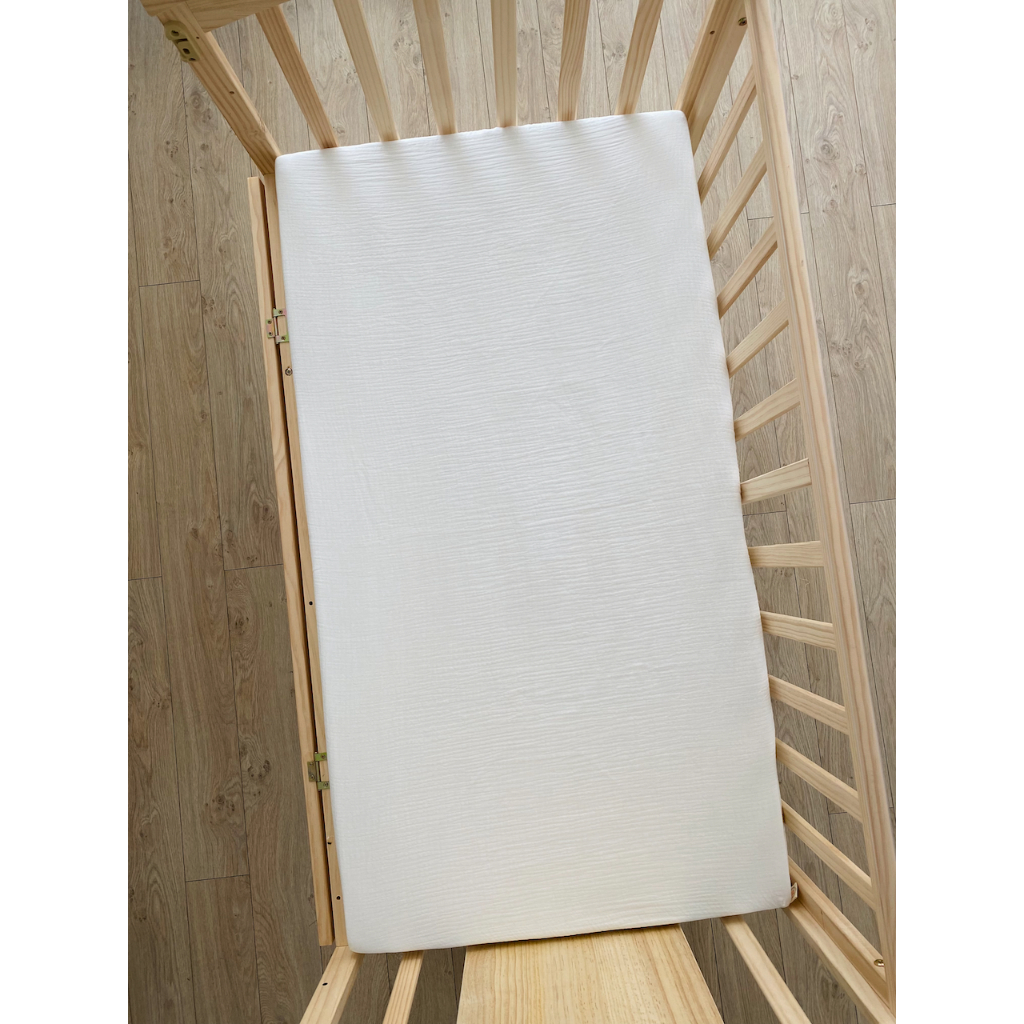 Ga bọc nệm cũi 62x114cm cho bé PETIT BEBE muslin bo chun màu trơn