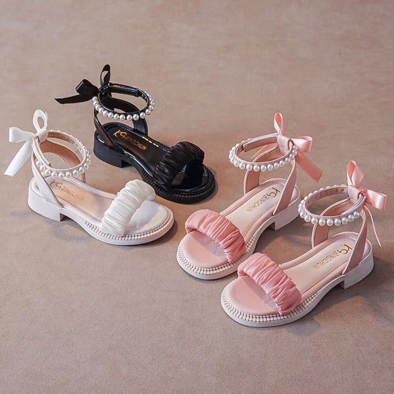 Sandal bé gái dép quai hậu cho bé nhún bèo đính ngọc nơ xinh xắn đi tiệc điệu đế chống trượt êm chân QCCC .