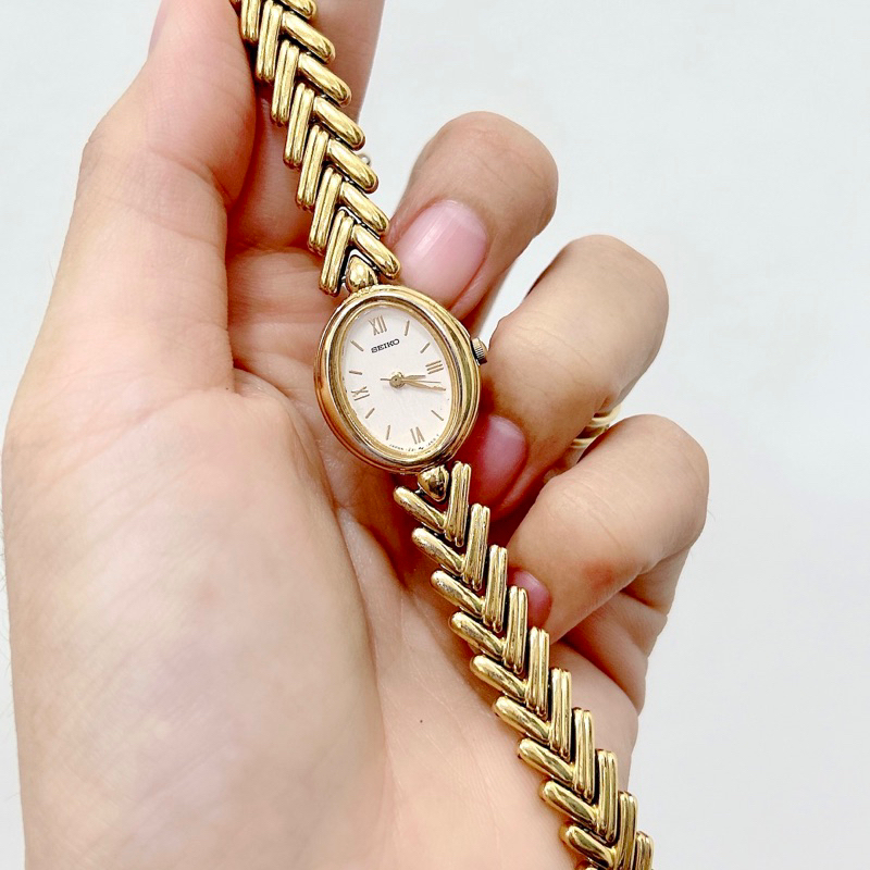 Đồng hồ si nữ hiệu Seiko, dây kim loại vàng