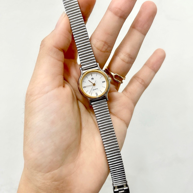 Đồng hồ si nữ máy nhật hiệu Noevip, mặt tròn dây kim loại trắng