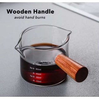 Cốc đong thủy tinh nguyên cốc là 100 ml chia vạch 75 ml