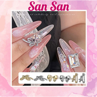 Charm nơ hợp kim vàng bạc đính móng