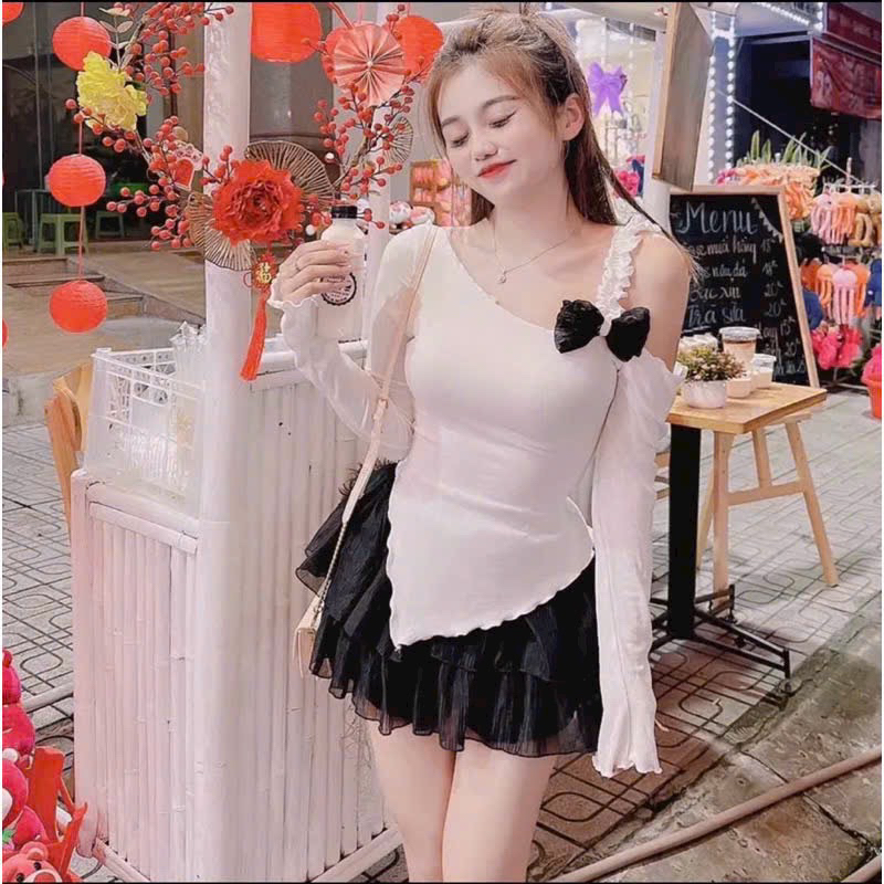 Áo kiểu lệch vai đính nơ vạt chéo tay dài dáng tiểu thư dễ mặc