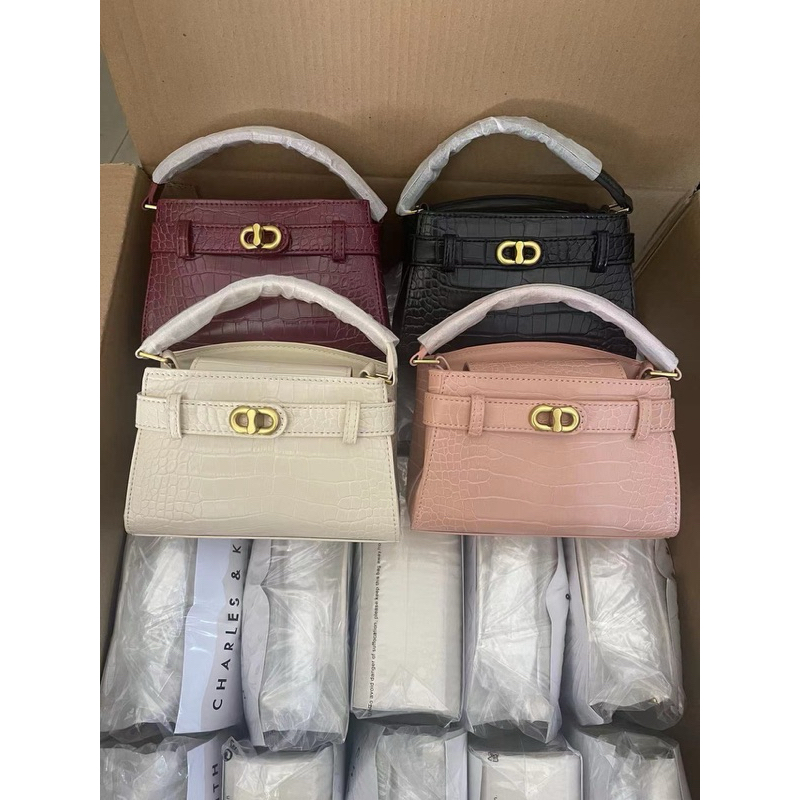 Túi khoá xoay phiên bản da rắn new