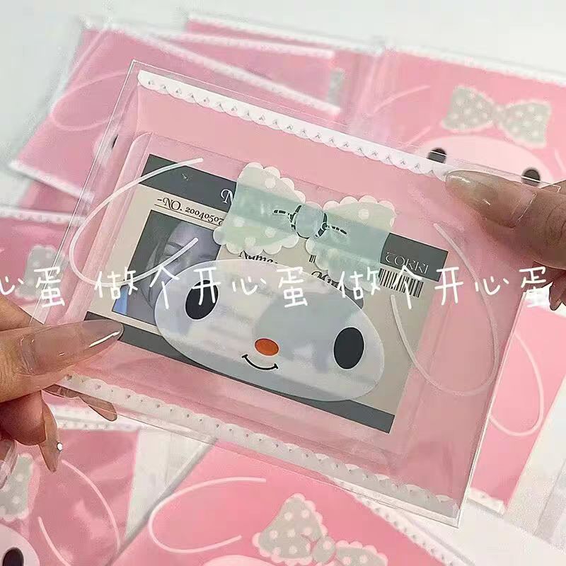 Set 100c Túi bóng kính Melody nơ xanh dán miệng size 10x13+3