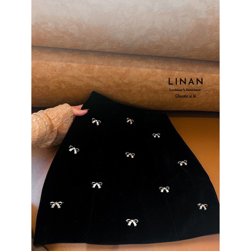 Chân váy nhung chữ A đính nơ