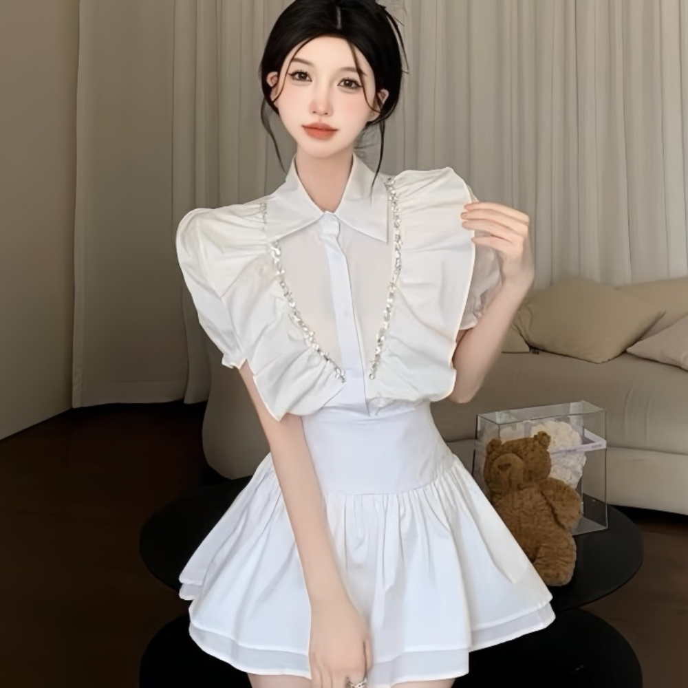 Set áo bèo cổ sơ mi phối viền đá mix chân váy tâng xoè, phù hợp với cô nàng thích phong cách tiểu thư bánh bèo
