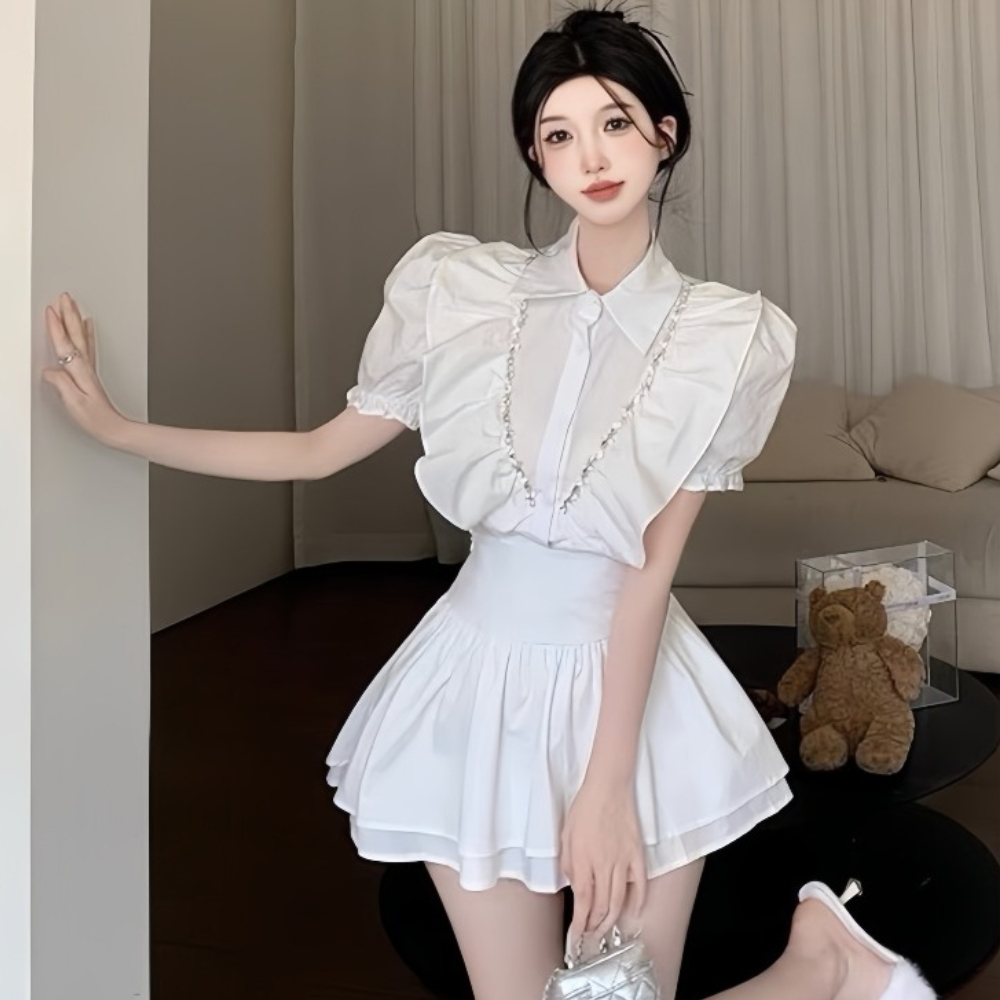 Set áo bèo cổ sơ mi phối viền đá mix chân váy tâng xoè, phù hợp với cô nàng thích phong cách tiểu thư bánh bèo