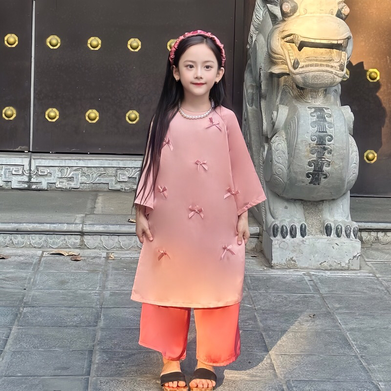 Áo Dài Lụa Bé Gái Cách Tân Màu Hồng Baby Đính Nơ Cute Kèm Bờm