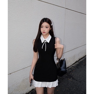 Đầm đen phối xếp li trắng