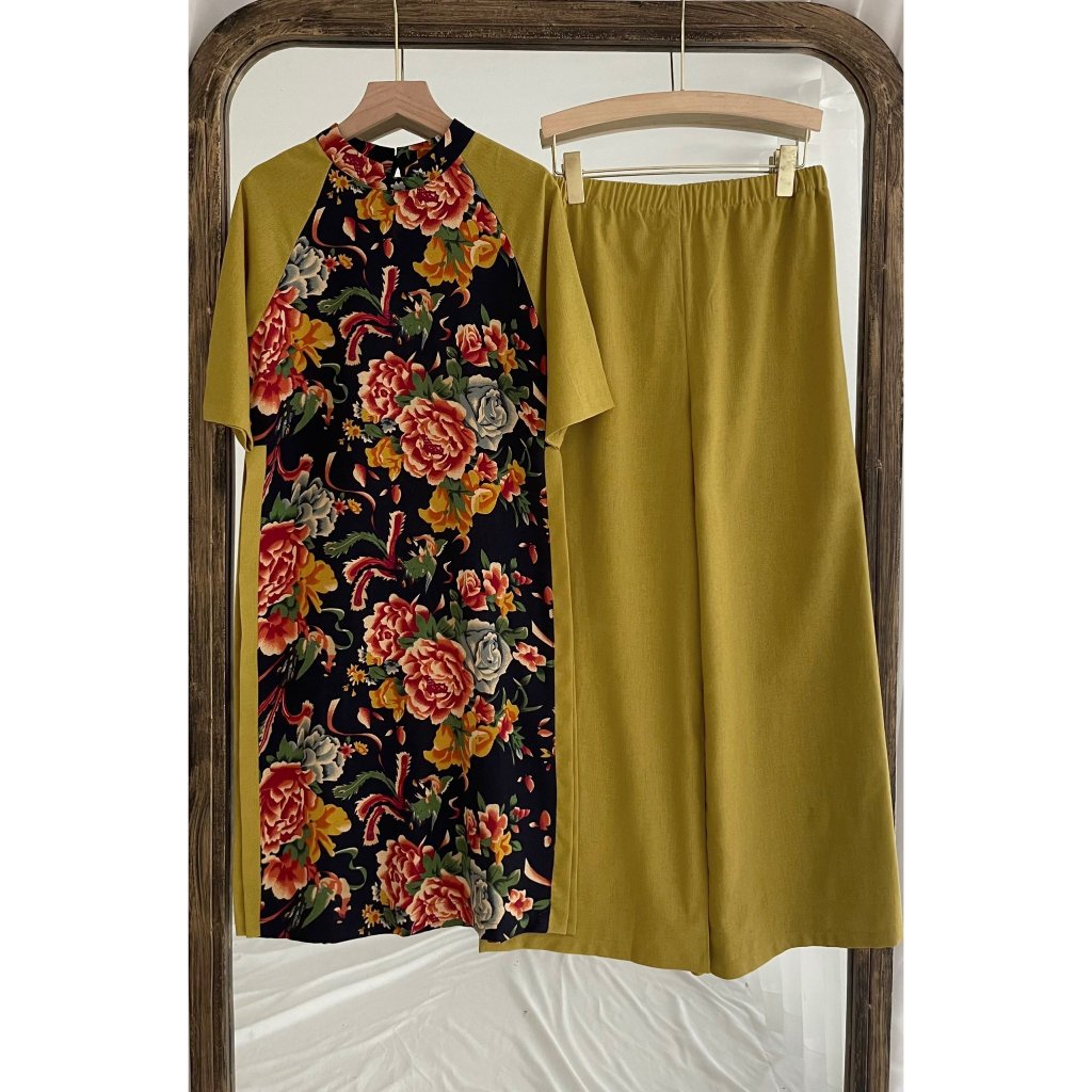 Aó dài con công họa tiết sang chảnh 3 màu vàng, đỏ và xanh.