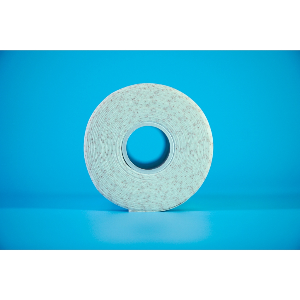 Cuộn băng keo y tế co giãn Tigerplast Carifix Stretch dán bông gạc - Tấm 10cm dài 10m