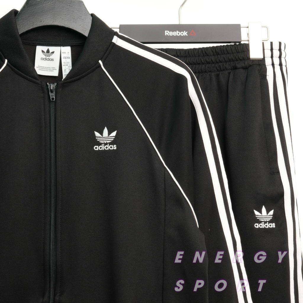 Bộ Quần Áo Thể Thao Unisex Nam Nữ Adidas Adicolor Classic Primeblue SST Track - Màu Đen