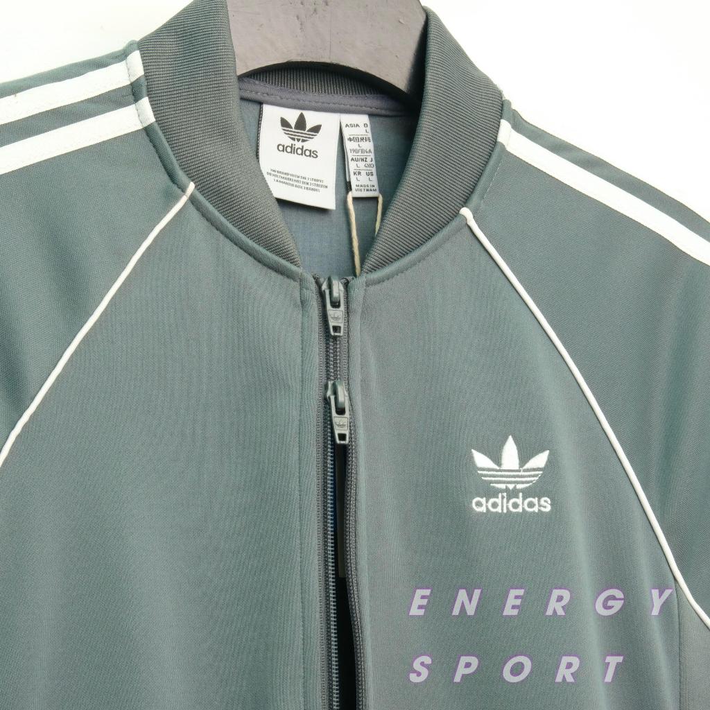 Bộ Quần Áo Thể Thao Unisex Nam Nữ Adidas Adicolor Classic Primeblue SST Track - Màu Xi Măng