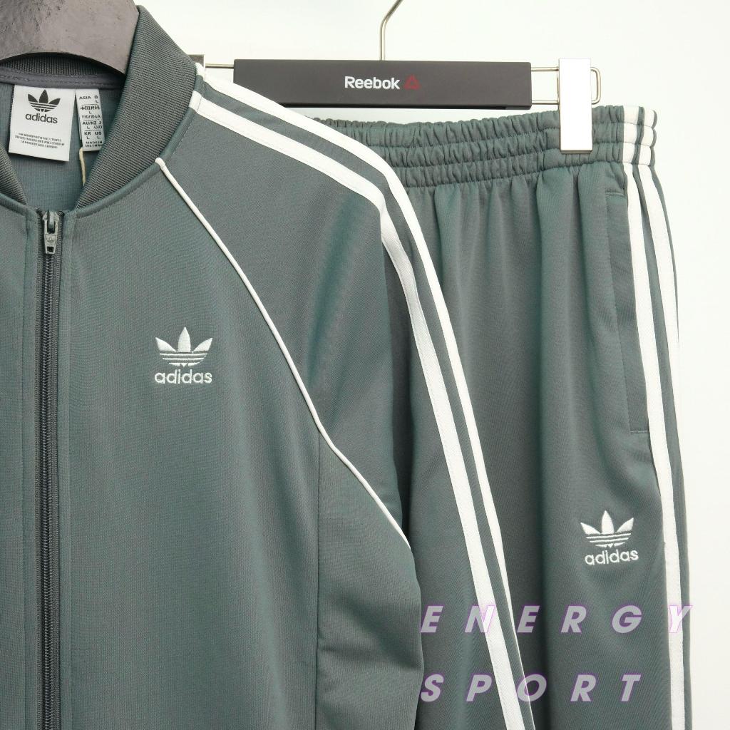 Bộ Quần Áo Thể Thao Unisex Nam Nữ Adidas Adicolor Classic Primeblue SST Track - Màu Xi Măng