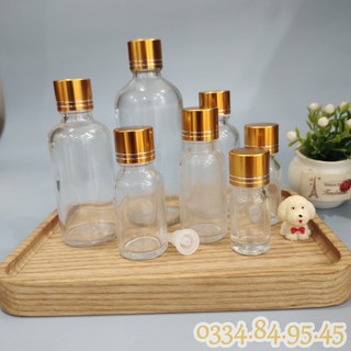 Chai thủy tinh đựng GINGER SHOTS TRONG nắp vặn XI VÀNG 5ml/10ml/15ml/20ml/30ml/50ml/100ml, lọ chiết serum, dầu tràm, tin