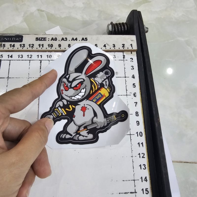 Tem sticker thỏ điên cầm phuộc OH 10cm