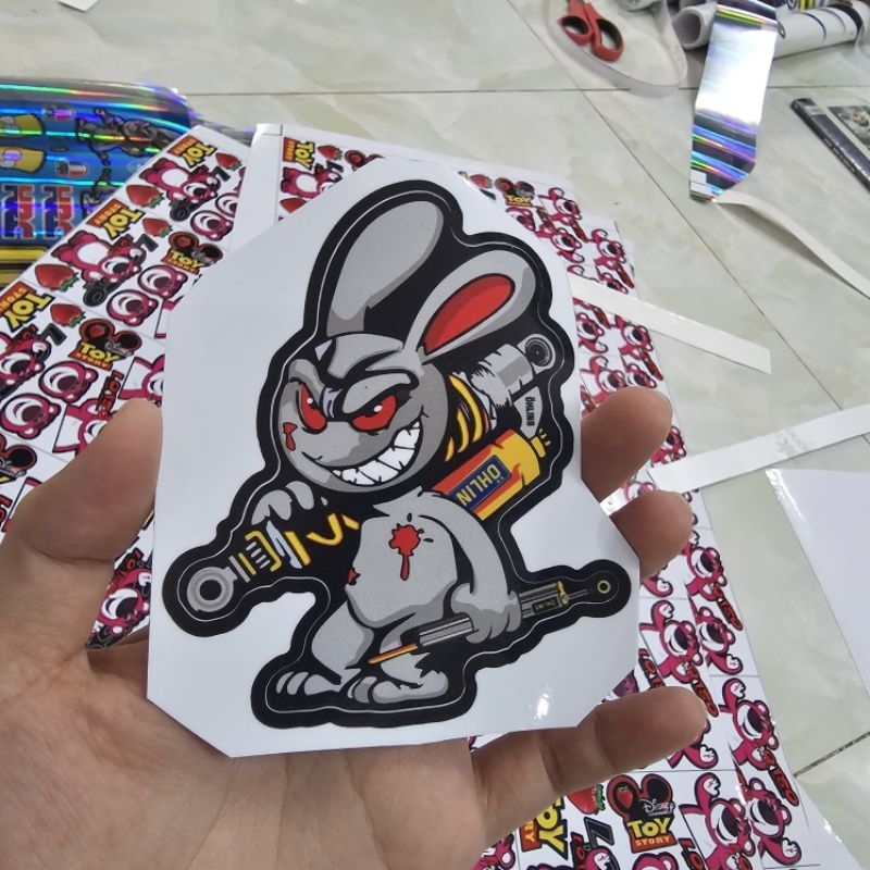 Tem sticker thỏ điên cầm phuộc OH 10cm