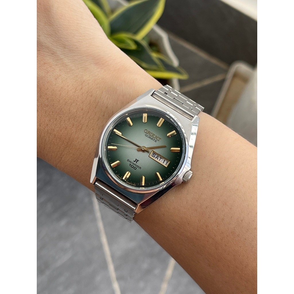 Đồng hồ nam Orient mặt xanh chạy pin hàng Si