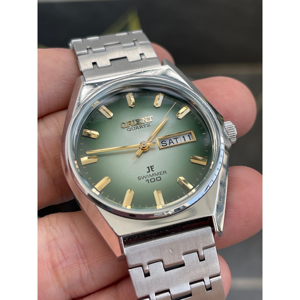 Đồng hồ nam Orient mặt xanh chạy pin hàng Si