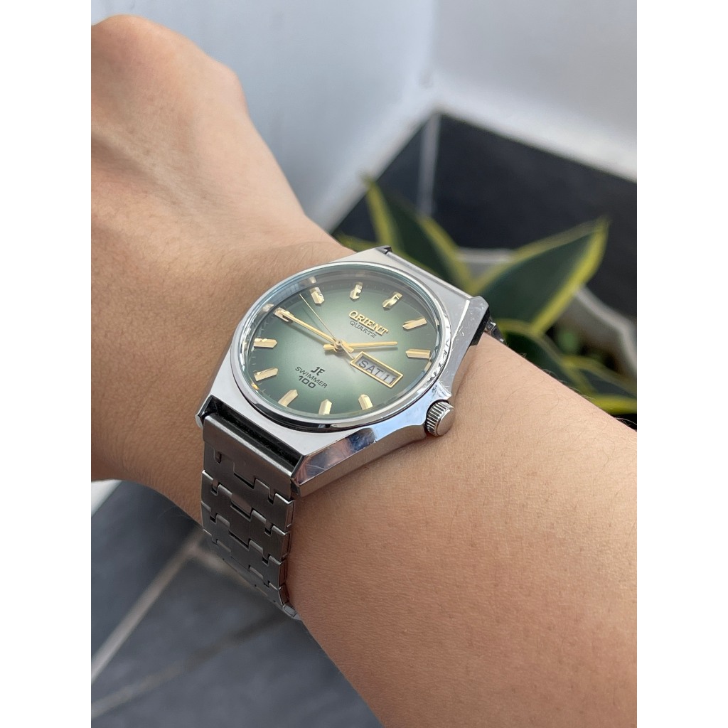Đồng hồ nam Orient mặt xanh chạy pin hàng Si