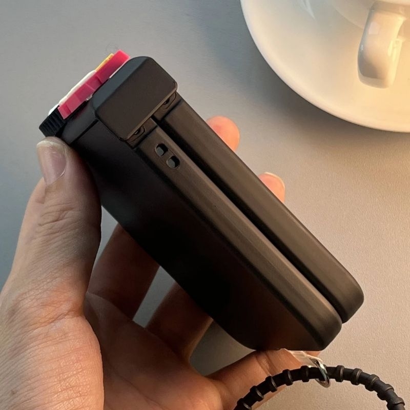 Ốp Z Flip5 - Z Flip4 - Z Flip3 - Flip5 5G đen matte charm bánh và dây pompom dễ thương kèm thanh bảo vệ bản lề